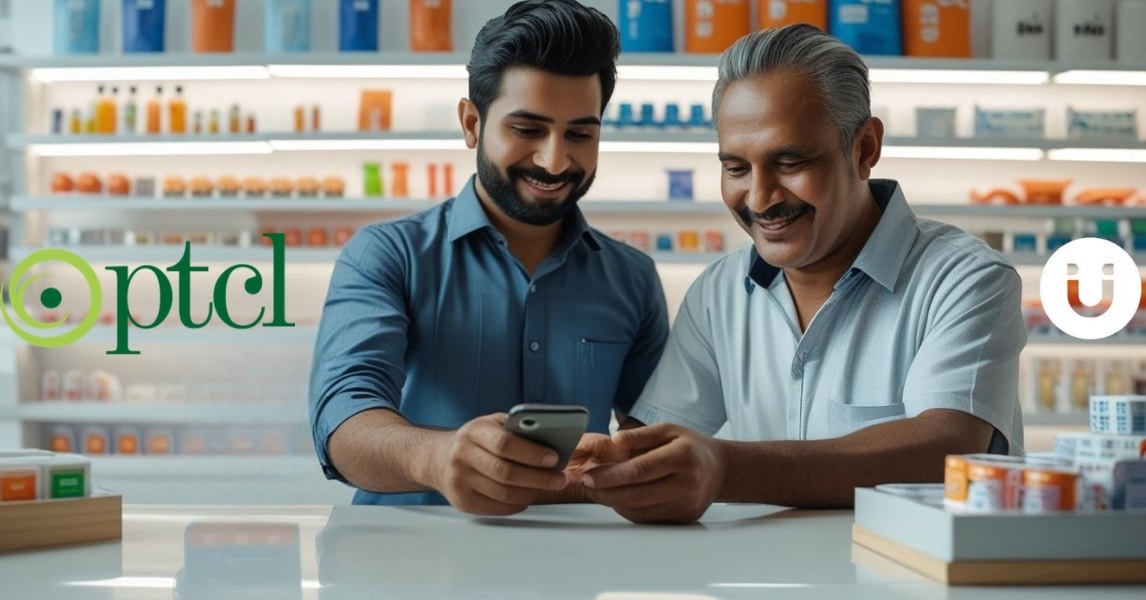 Pakistani male retailer using Udhaar Book app on smartphone to assist male customer with PTCL bill payment