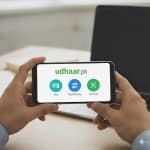 Mobile wallet app on phone used for digital payments in Pakistan.